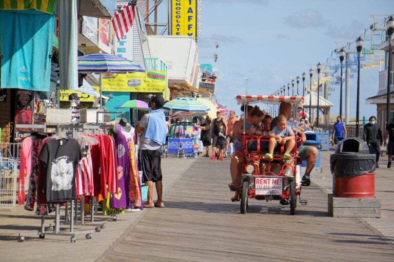 People ride bikes on the boardwalk