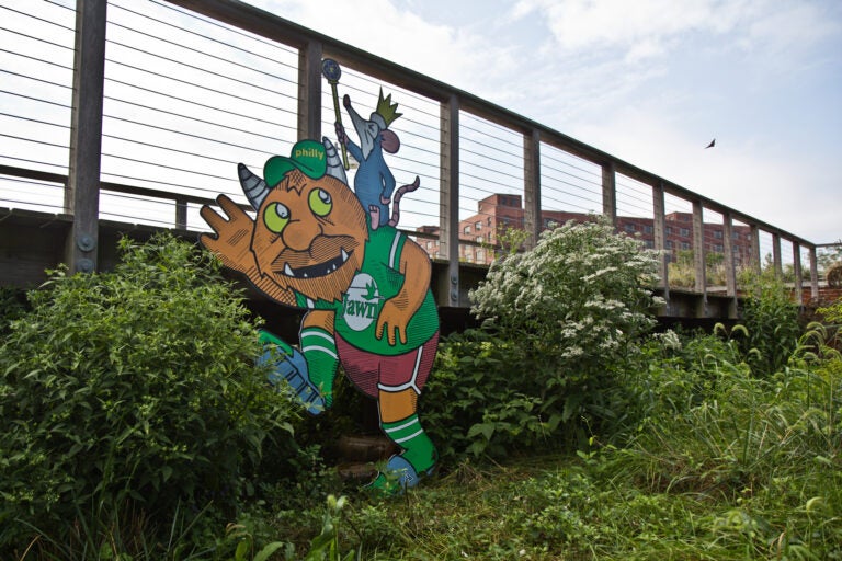 A troll by artist Kid Hazo under a footbridge at Philadelphia’s Navy Yard. (Kimberly Paynter/WHYY)