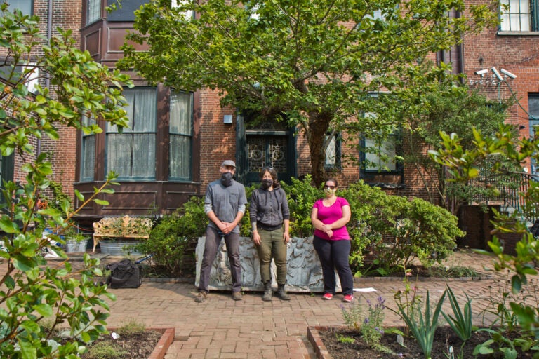 Members of the Rosenbach staff standing in front of the Rosenbach's garden