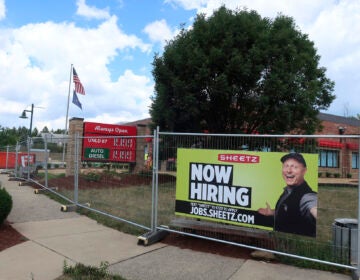 A ‘Now Hiring’ sign hangs in front of a Sheetz convenience store and gas station under construction on Tuesday, August 18, 2020 in Wexford, Pennsylvania. (AP Photo/Ted Shaffrey)