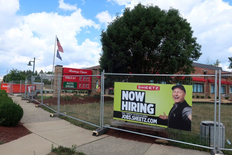 A ‘Now Hiring’ sign hangs in front of a Sheetz convenience store and gas station under construction on Tuesday, August 18, 2020 in Wexford, Pennsylvania. (AP Photo/Ted Shaffrey)