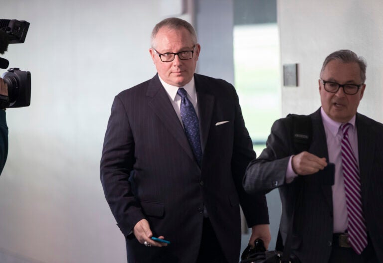Former Trump Campaign official Michael Caputo, center, joined by his attorney Dennis C. Vacco, right, leaves after a three-hour interview by Senate Intelligence Committee staff that is investigating Russian meddling in the 2016 presidential election, on Capitol Hill in Washington, Tuesday, May 1, 2018. (AP Photo/J. Scott Applewhite)