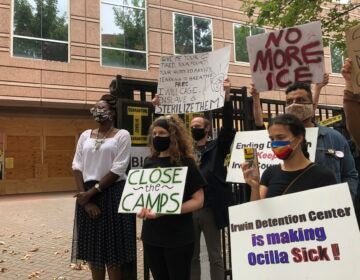 Dawn Wooten, left, a nurse at Irwin County Detention Center in Ocilla, Georgia, speaks at a news conference in Atlanta