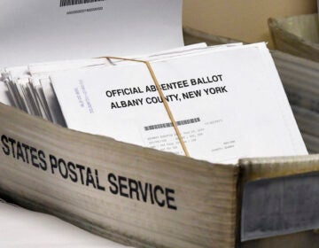 Box of absentee ballots waiting to be counted at the Albany County Board of Elections, Tuesday, June 30, 2020, in Albany, N.Y. (AP Photo/Hans Pennink)