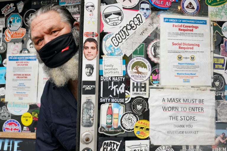 Julian Siegel, owner of The Riverside Market, poses for a photo, Monday, Sept. 21, 2020, in Fort Lauderdale, Fla. Siegel figures business dropped about 20% earlier this spring at his, restaurant after someone posted a picture on the Nextdoor app of people waiting in his parking lot for food. (AP Photo/Wilfredo Lee)