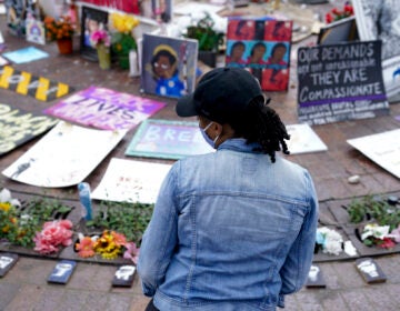 Millicent Cahoon stands for a portrait, Thursday, Sept. 24, 2020, in Louisville, Ky. “It’s reiterating to me that my life does not matter, that I’m unsafe,” said Millicent Cahoon, a therapist who started a counseling network for the protest movement. (AP Photo/John Minchillo)