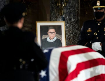 The flag-draped casket of Justice Ruth Bader Ginsburg lies in state in the U.S. Capitol on Friday, Sept. 25, 2020. Ginsburg died at the age of 87 on Sept. 18 and is the first women to lie in state at the Capitol. (Erin Schaff/The New York Times via AP, Pool)