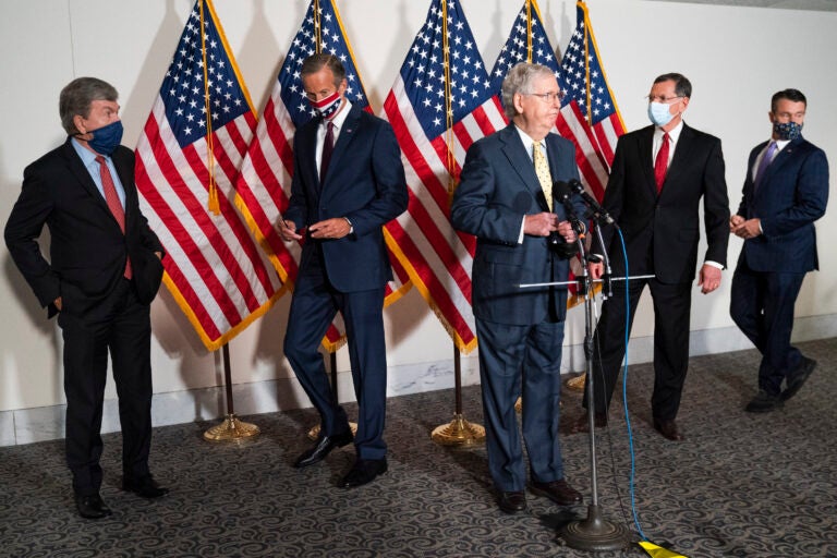 Senate Majority Leader Mitch McConnell of Ky., center, approaches the microphones accompanied by, from left, Sen. Roy Blunt, R-Mo., Sen. John Thune, R-S.D., Sen. John Barrasso, R-Wyo., and Sen. Todd Young, R-Ind., at the start of a news conference, Wednesday, Sept. 9, 2020, on Capitol Hill in Washington. (AP Photo/Jacquelyn Martin)