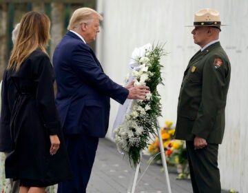 President Donald Trump lays a wreath at a 19th anniversary observance of the Sept. 11 terror attacks, at the Flight 93 National Memorial in Shanksville, Pa., Friday, Sept. 11, 2020. (AP Photo/Alex Brandon)
