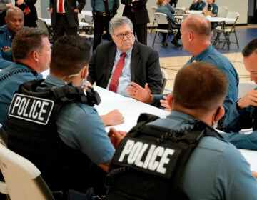 Attorney General William Barr participates in a roll call with police officers from the Kansas City Police Department
