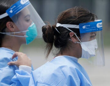 Healthcare workers at a COVID-19 testing site