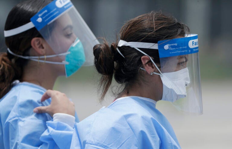 Healthcare workers at a COVID-19 testing site