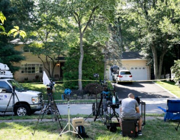 News media is set up in front of the home of U.S. District Judge Esther Salas