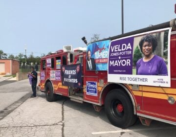 Members of the Wilmington firefighters' union came out in force for mayoral hopeful Velda Jones-Potter and other city candidates Tuesday. (Cris Barrish/WHYY)