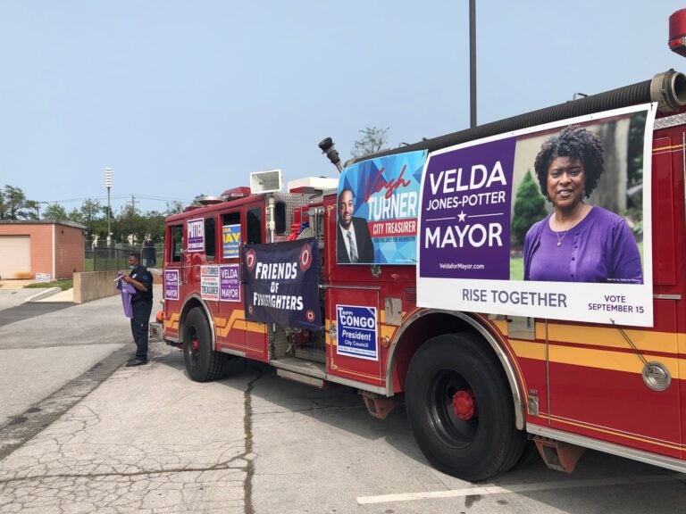 Members of the Wilmington firefighters' union came out in force for mayoral hopeful Velda Jones-Potter and other city candidates Tuesday. (Cris Barrish/WHYY)