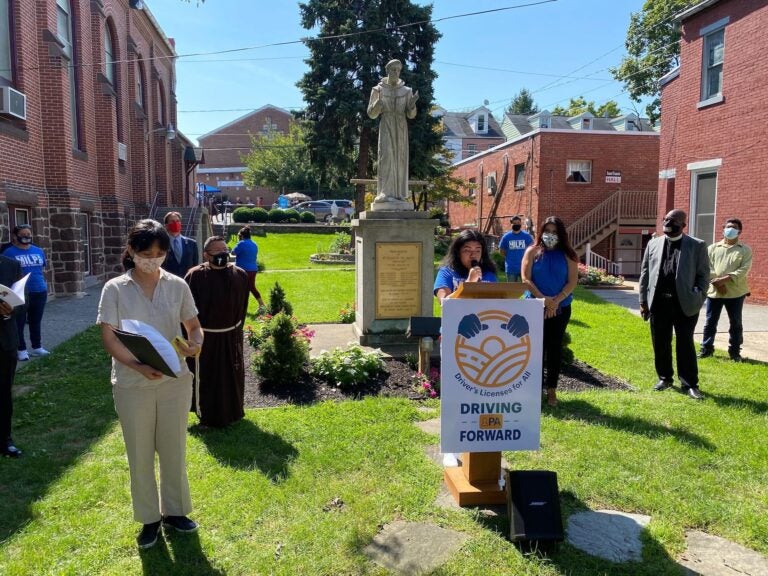 Julissa Morales, a member of the Movement of Immigrant Leaders in Pennsylvania, speaks at a press conference in Harrisburg regarding PennDOT's practice of sharing drivers' private data and information. (Alanna Elder/WITF)