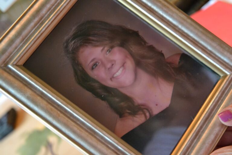 In this June 2019 photo, Martha Stringer holds a photo of her daughter, Kim. (Brett Sholtis / Transforming Health)