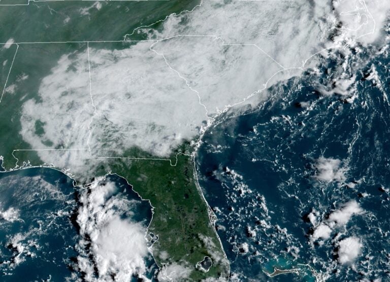 A geocolor image shows the view from a NOAA satellite over the East Coast.