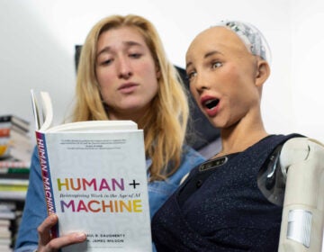 Sarah Rose Siskind reads a book to Sophia the Robot, an interviewer, guest speaker and host with over 16,000 YouTube subscribers. (Image courtesy of Nikki Thomas)