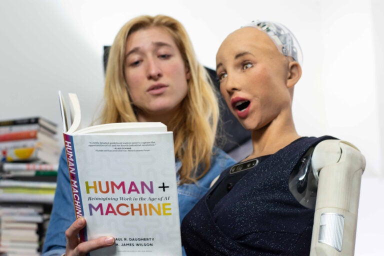 Sarah Rose Siskind reads a book to Sophia the Robot, an interviewer, guest speaker and host with over 16,000 YouTube subscribers. (Image courtesy of Nikki Thomas)