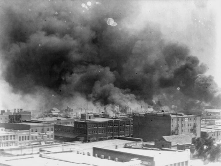 In this 1921 image provided by the Library of Congress, smoke billows over Tulsa, Okla., the scene of one of the nation's most brutal race massacres. (Alvin C. Krupnick Co./AP)