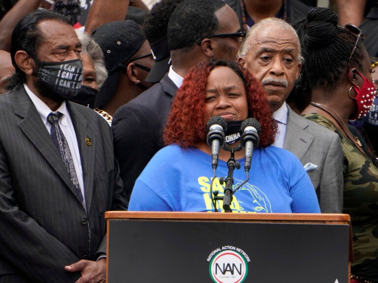 Tamika Palmer spoke at the March on Washington last month at the Lincoln Memorial in Washington, D.C. At left is Rep. Al Green, D-Texas, and at right is Rev. Al Sharpton. (Jacquelyn Martin/AP Photo)