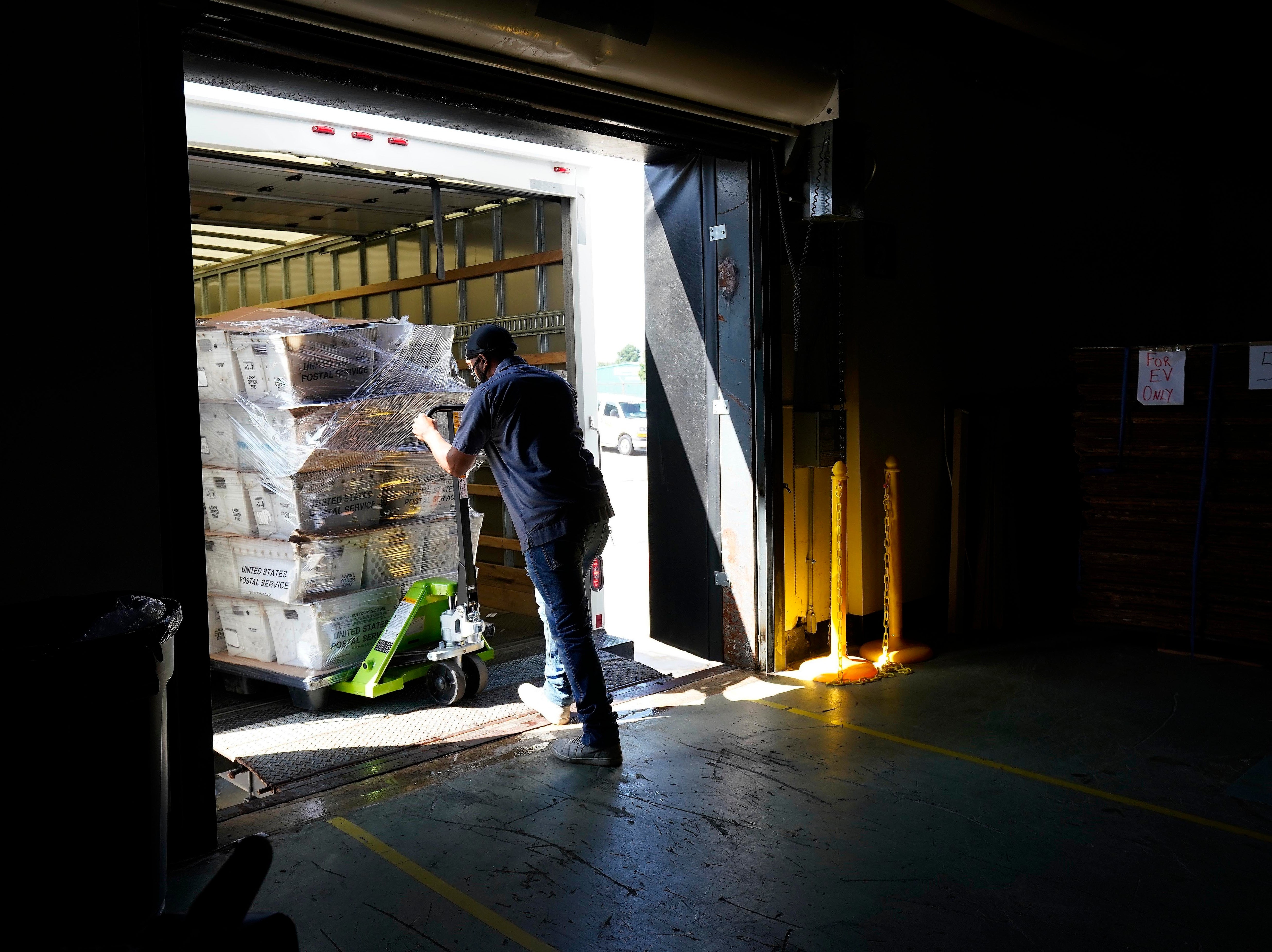 Absentee ballots are loaded onto a truck for mailing earlier this month at the Wake County, N.C., Board of Elections.