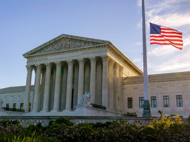 The flag flies at half-staff Saturday at the Supreme Court on the morning after the death of Justice Ruth Bader Ginsburg. (J. Scott Applewhite/AP Photo)