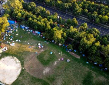 The encampment at Von Colln Field on the Ben Franklin Parkway, seen from above in late July. (Mark Henninger/Imagic Digital)