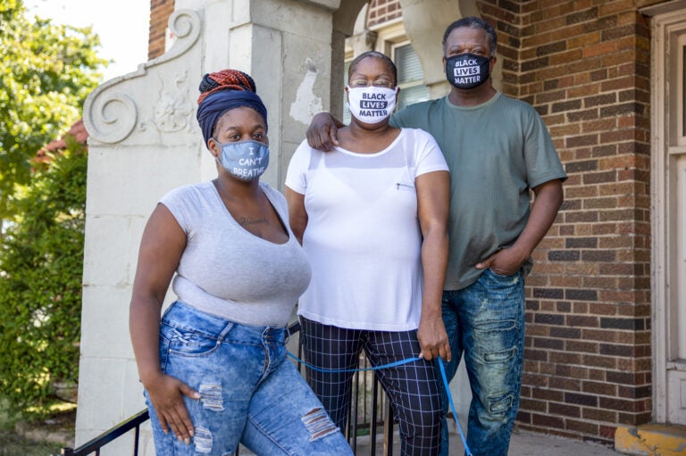 From left, Heavenly, Stephanie and Robert and Pettigrew are seen outside their two-bedroom rental apartment in Milwaukee