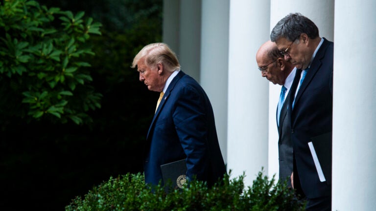 President Trump, Commerce Secretary Wilbur Ross (center) and U.S. Attorney General William Barr walk into the White House Rose Garden for a July 2019 press conference on the census. (Jabin Botsford/The Washington Post via Getty Images)