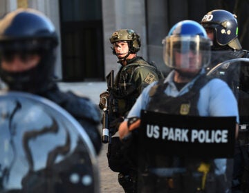 U.S. Park Police and other federal officers hold a perimeter near the White House on June 1 as demonstrators gather to protest the killing of George Floyd.
Olivier Douliery/AFP via Getty Images