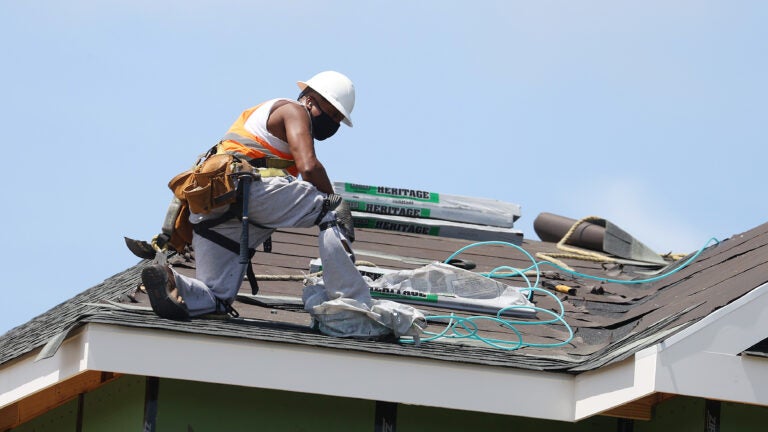 A construction worker roofs an apartment complex in Uniondale, N.Y., on May 27. U.S. employers added fewer jobs last month even as the unemployment rate fell to 8.4%. A construction worker roofs an apartment complex in Uniondale, N.Y., on May 27. U.S. employers added fewer jobs last month even as the unemployment rate fell to 8.4%. (Al Bello/Getty Images)