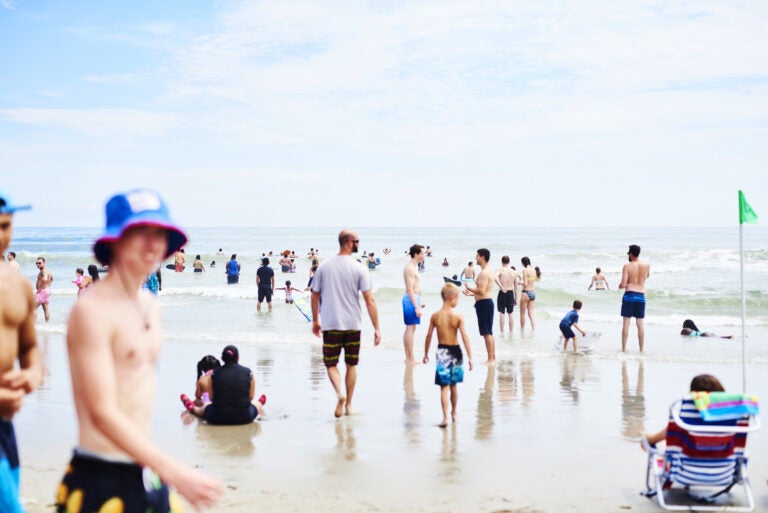 People roamed the beach in Ocean City, N.J, at the start of August. As Labor Day weekend arrives, Dr. Anthony Fauci, director of the National Institute of Allergy and Infectious Diseases, says Americans should remain vigilant to avoid another surge in coronavirus infection rates. (Gabby Jones/Bloomberg via Getty Images)
