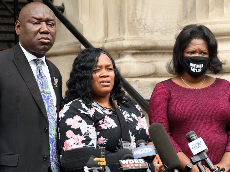 Breonna Taylor's mother, Tamika Palmer, says the justice system failed her daughter, an emergency room technician who was shot and killed by police in her own apartment in March. Palmer released a statement through her sister Friday, after a grand jury declined to level any charges directly related to Taylor's death. Palmer is seen here in August, speaking outside Louisville City Hall. (John Sommers II/Getty Images)