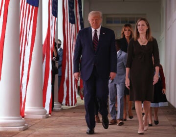 President Trump and Supreme Court nominee Amy Coney Barrett walk along the Rose Garden Colonnade on Saturday. The focus on the court just weeks before the election could help energize conservatives in key states.