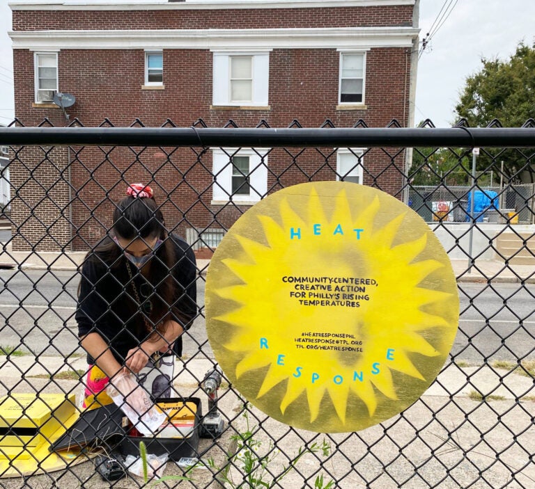 Jenna Robb distributes postcards in Grays Ferry. (Courtesy of Jenna Robb)