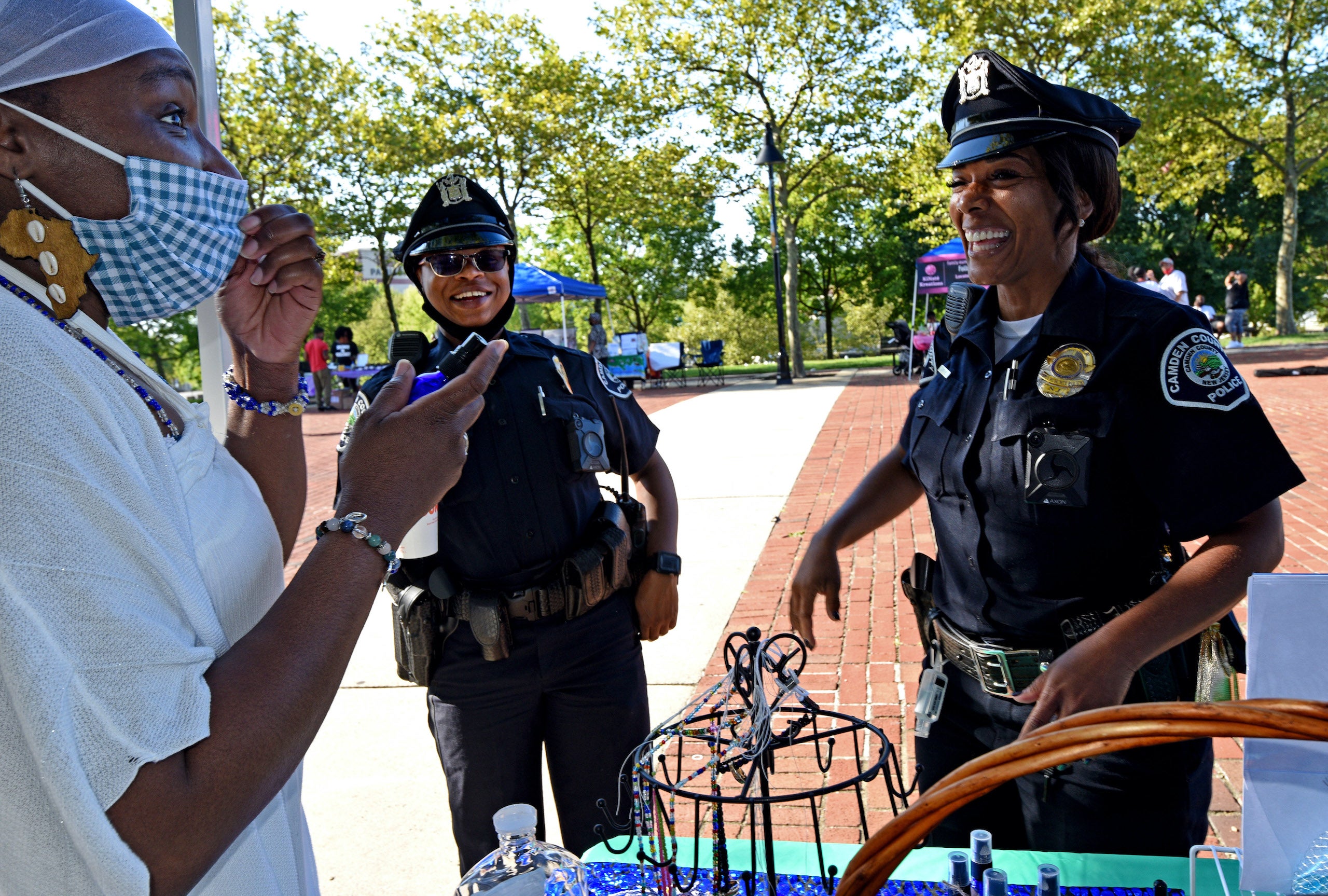 Shawnta Taylor with Camden County police officers Deborah Baker and Tawand Smith at Masked Melanin Market