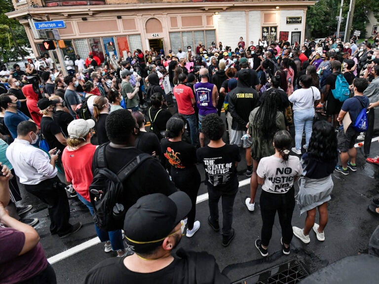 A crowd of protesters gathers in Rochester, N.Y., near the site where Daniel Prude was restrained by police officers in March. Prude, a Black man who had run naked through the streets of the western New York city, died of asphyxiation a week later.