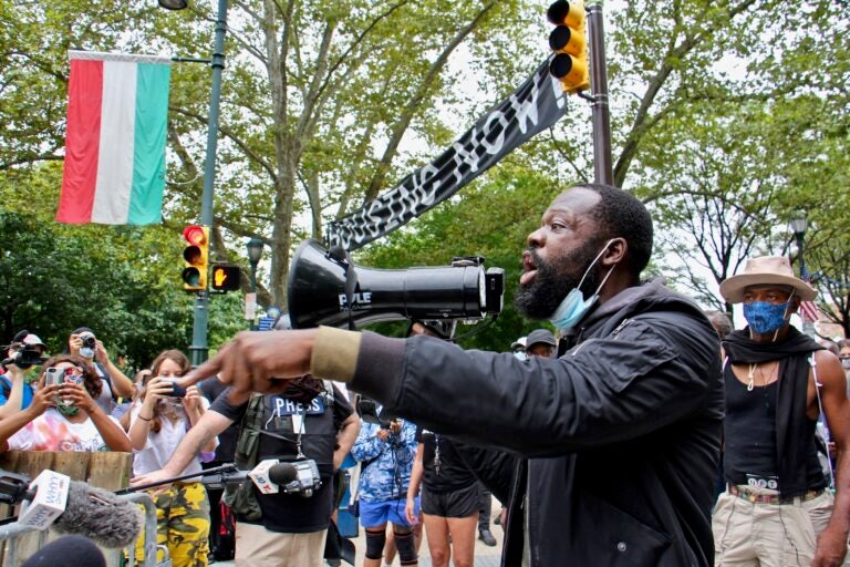 Anthony Lloyd, a resident of the homeless encampment on the Ben Franklin Parkway challenges the city’s order to clear the camp. (Emma Lee/WHYY)