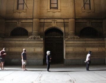 Voters line up at Philadelphia City Hall to drop off their mail ballots