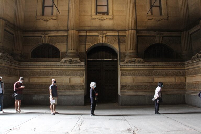 Voters line up at Philadelphia City Hall to drop off their mail ballots