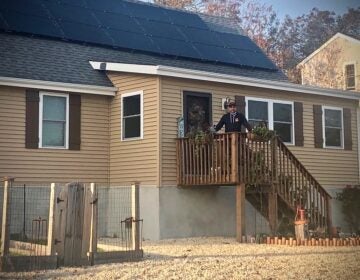 Joe Mangino stands on the porch of his home in Beach Haven West, New Jersey