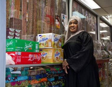 Satte Hoffe at her store in West Philadelphia. She’s a Liberian immigrant who said she’s voting because she fears a civil war. (Kimberly Paynter/WHYY)