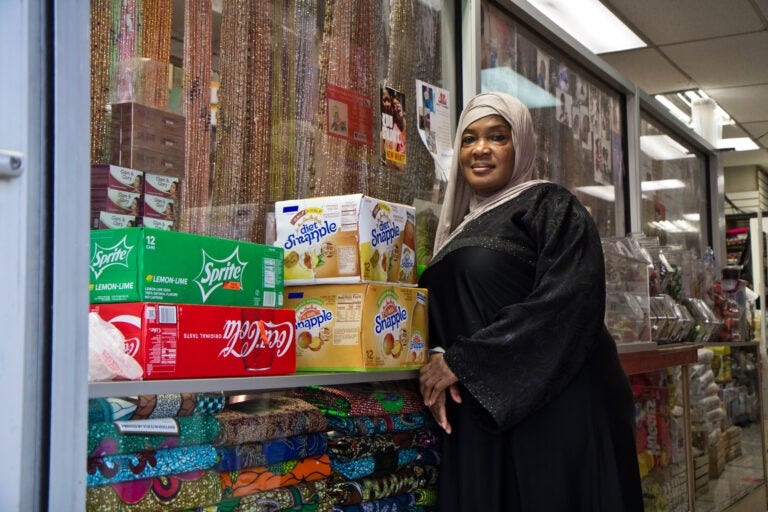 Satte Hoffe at her store in West Philadelphia. She’s a Liberian immigrant who said she’s voting because she fears a civil war. (Kimberly Paynter/WHYY)