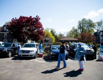 People in their vehicles receive COVID-19 tests at a barrier free location outside the Pinn Memorial Baptist Church in Philadelphia, Wednesday, April 22, 2020. (AP Photo/Matt Rourke)