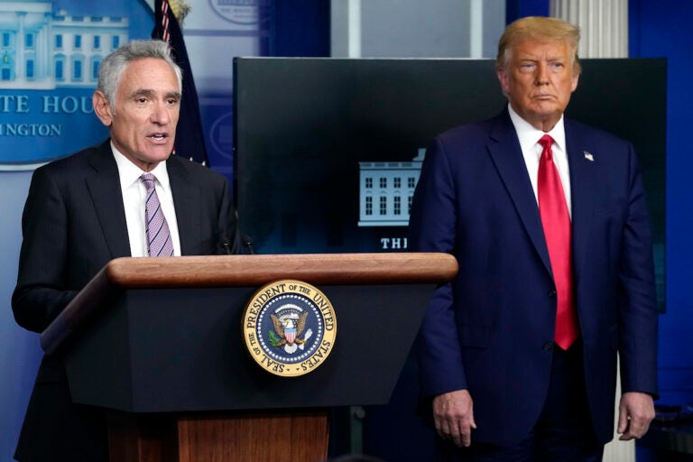 White House coronavirus adviser Dr. Scott Atlas speaks as President Donald Trump listens during a news conference at the White House, Wednesday, Sept. 16, 2020, in Washington. (AP Photo/Evan Vucci)