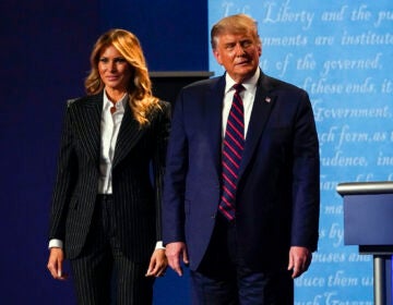 President Donald Trump stands on stage with first lady Melania Trump after the first presidential debate with Democratic presidential candidate former Vice President Joe Biden Tuesday, Sept. 29, 2020, at Case Western University and Cleveland Clinic, in Cleveland, Ohio. (AP Photo/Julio Cortez)