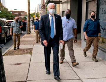 Democratic presidential candidate former Vice President Joe Biden stops to speak to members of the media as he walks out of the Queen Theater in Wilmington, Del., Thursday, Oct. 1, 2020, after pre-taping his speech for the Al Smith dinner. (AP Photo/Andrew Harnik)