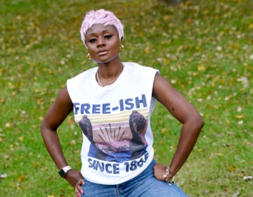 Nigerian American lifestyle blogger Nifesimi Akingbe, 31, stands outside her home in Randallstown, Md., near Baltimore, on Sunday, Oct. 11, 2020. (AP Photo/Steve Ruark)